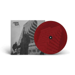 Red vinyl record with a black and white album cover featuring a band playing music.