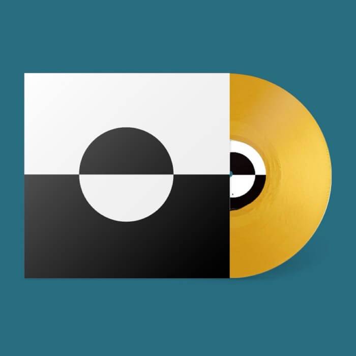 Vinyl record with geometric design on a teal background