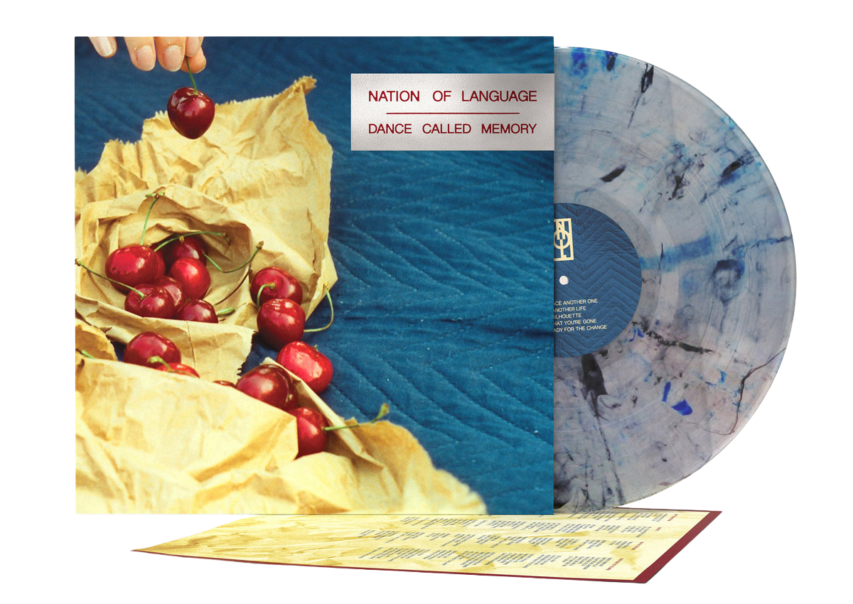 Vinyl record with cover featuring a bag of cherries and text 'Nation of Language Dance Called Memory'.