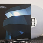 Vinyl record with cover titled 'Still Dark Sky' by New Haunts with a white wall background