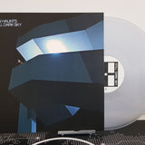 Vinyl record with cover titled 'Still Dark Sky' by New Haunts with a white wall background