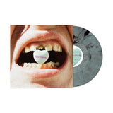 Vinyl record with a cover featuring an open mouth with a 'NOTHING' pill.