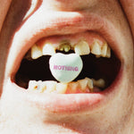 Mouth with a candy heart labeled 'NOTHING' inside