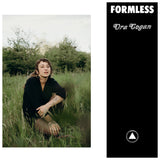 Album cover for Ora Cogan's "Formless" with a person sitting in a grassy field.