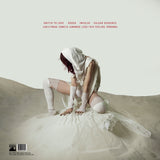Back cover for Paradox Obscur album featuring a person in a white outfit on a beach, labeled 'IKONA'.