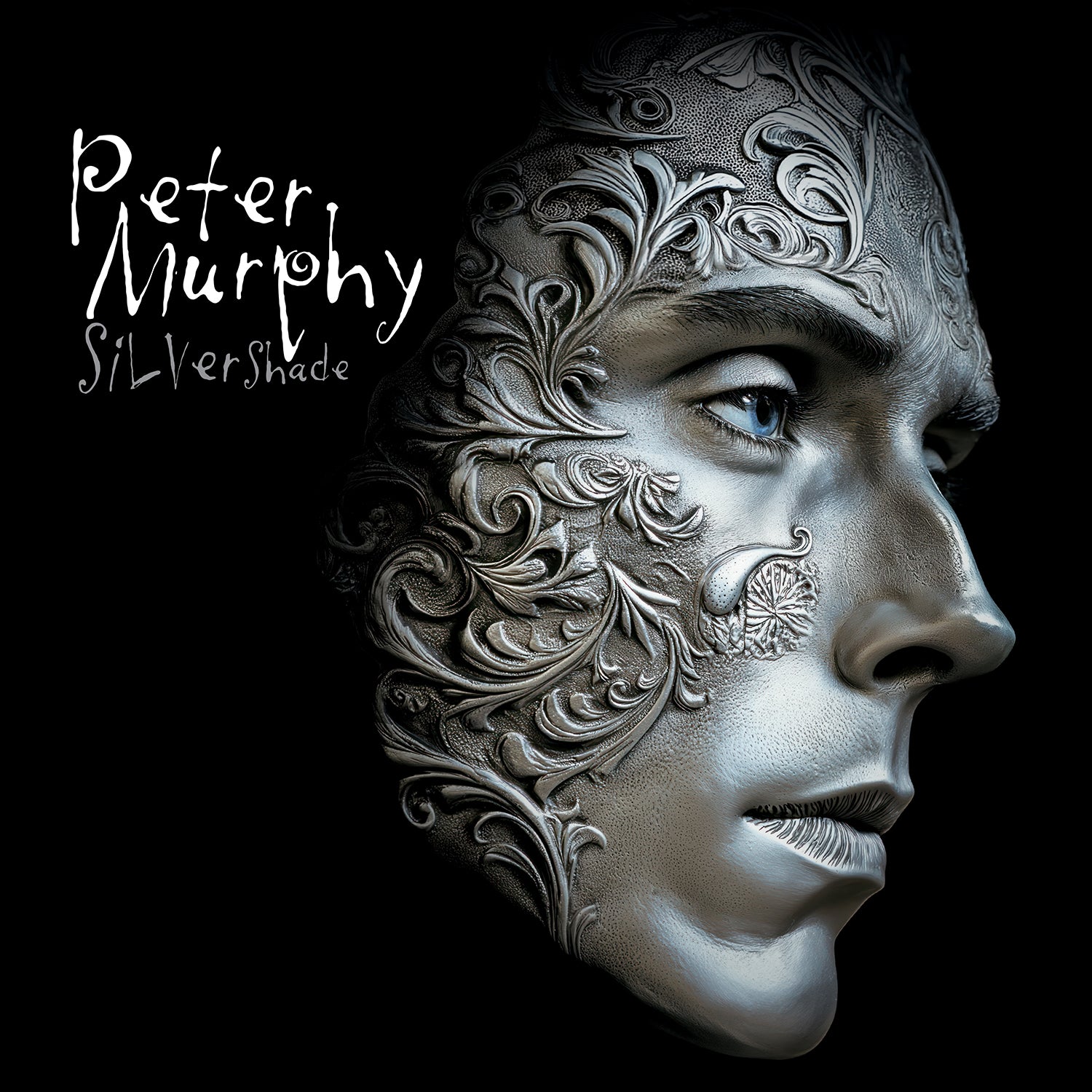 Album cover for Peter Murphy - Silver Shade with intricate patterns on a face, featuring the name 'Peter Murphy' and 'Silvershade'.