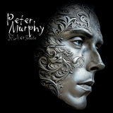 Album cover for Peter Murphy - Silver Shade with intricate patterns on a face, featuring the name 'Peter Murphy' and 'Silvershade'.