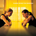 Album cover for Placebo's 'Without You I'm Nothing' with two people leaning on a table under yellow lighting.