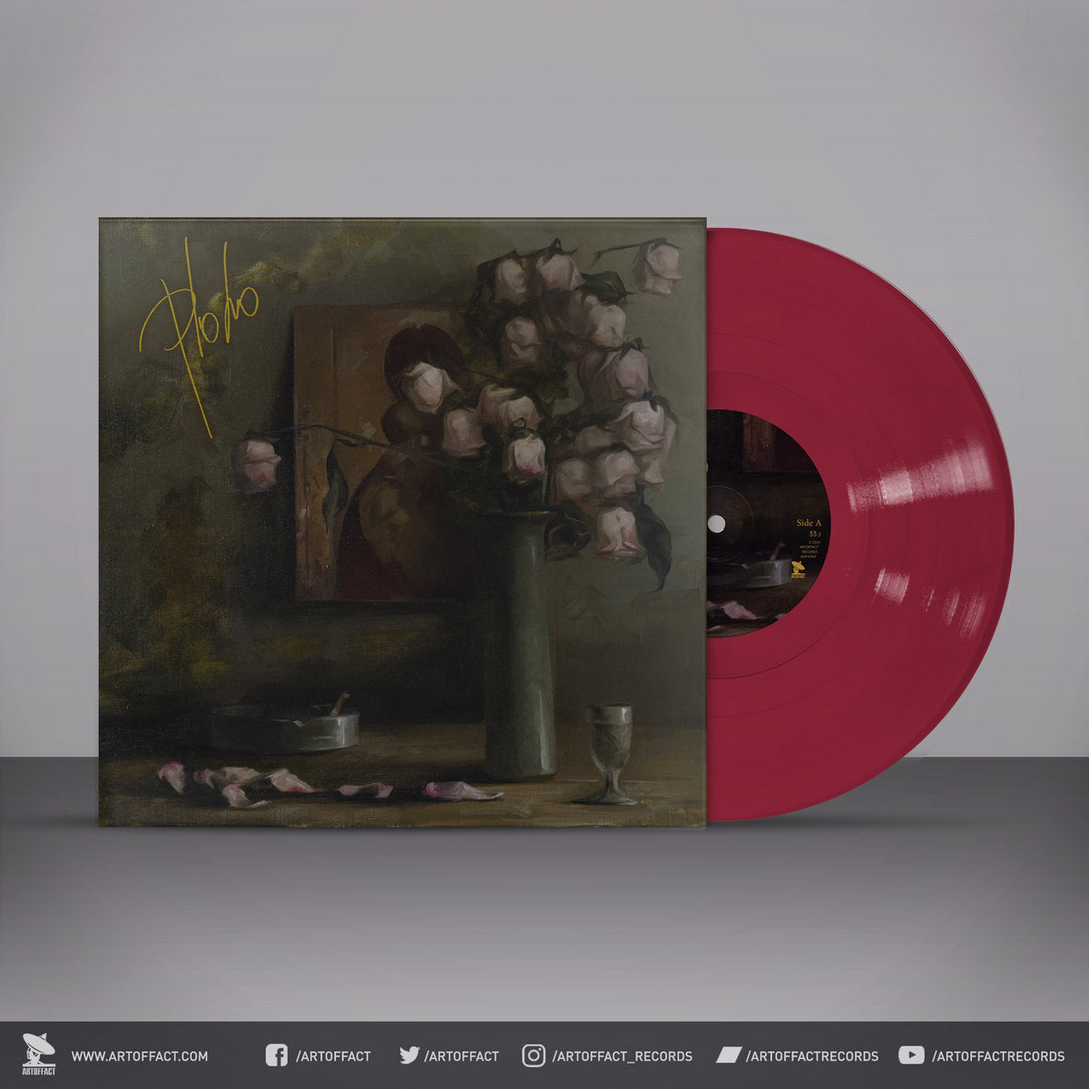 Vinyl record with a stylized cover featuring a still life painting and pink flowers on a gray background.