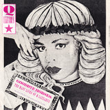 Album cover with stylized text and a person with a distinctive hairstyle.