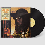 Vinyl record with a cover featuring a person in a hat and sunglasses, with 'Q Lazzarus' text.