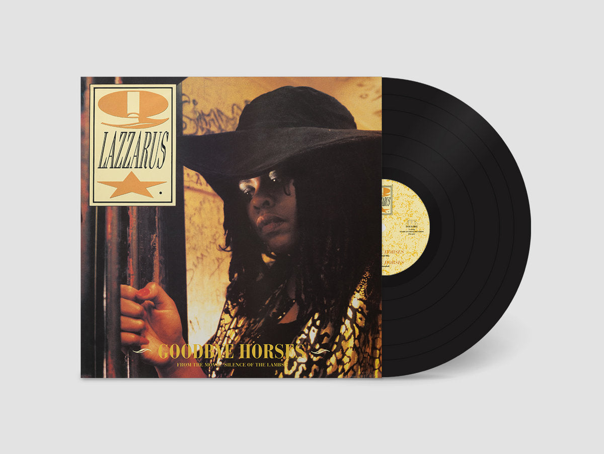 Vinyl record with a cover featuring a person in a hat and sunglasses, with 'Q Lazzarus' text.