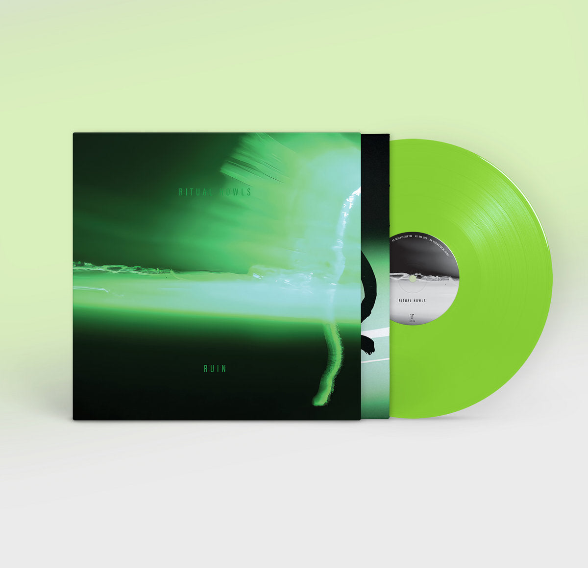 Green vinyl record and cover on a light green background