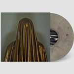 Vinyl record with a gold-veiled figure on the cover