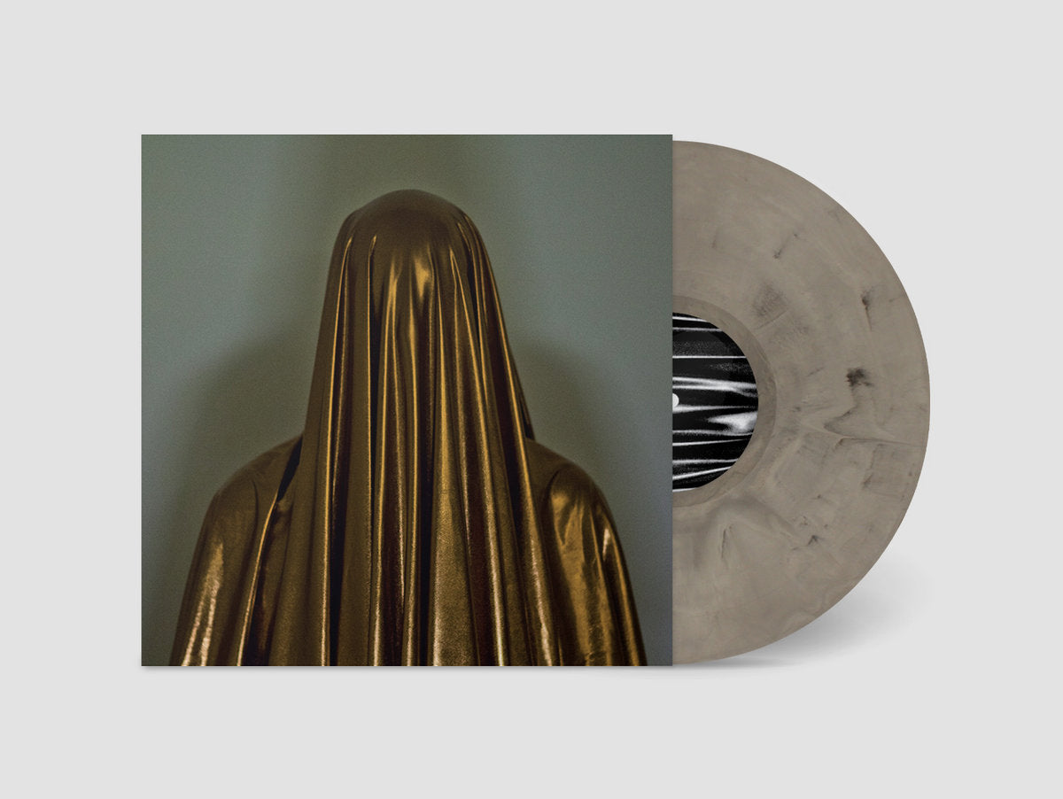 Vinyl record with a gold-veiled figure on the cover