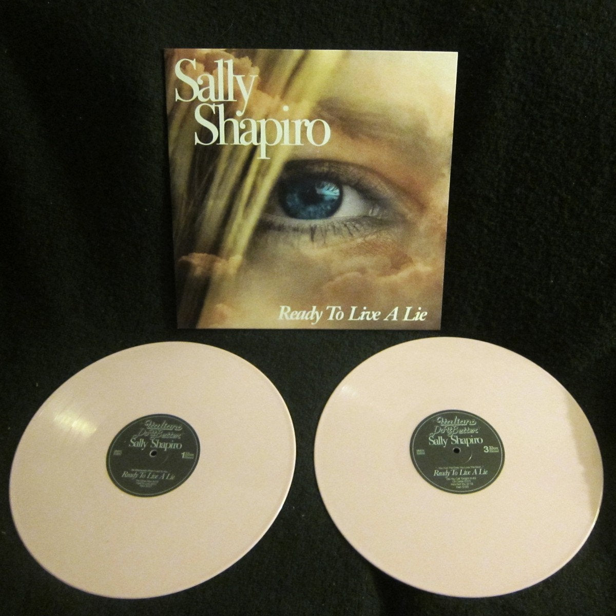 Vinyl records with a cover featuring an eye and 'Sally Shapiro - Ready to Live a LIe" text