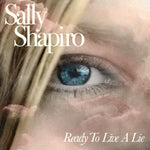 Album cover with a close-up of an eye and the text 'Sally Shapiro Ready To Live A Lie'.