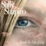 Album cover with a close-up of an eye and the text 'Sally Shapiro Ready To Live A Lie'.