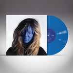 Vinyl record with a blue disc and cover featuring a person's face.
