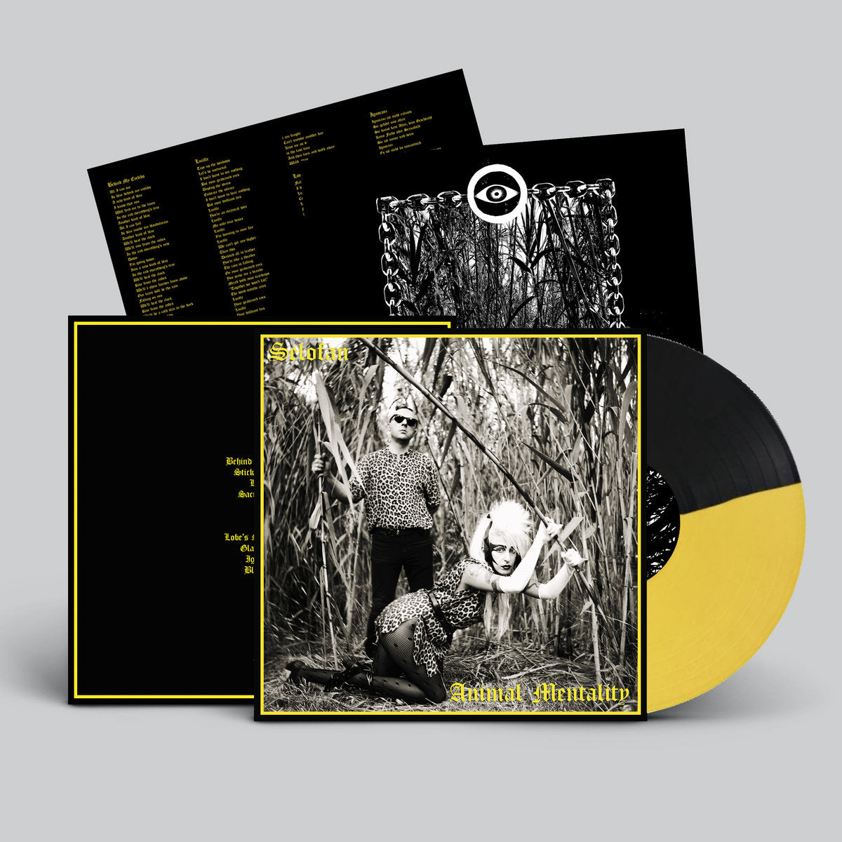 Vinyl record with black and yellow design, featuring a cover illustration of two people in a forest setting.