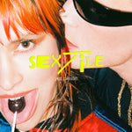 Sextile - yes, please. (Limited Edition) album with a close-up of a person with red hair and a person with sunglasses.