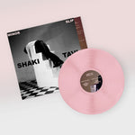 Vinyl record with pink disc and cover featuring 'Shaki' and 'Tavi' on a light background