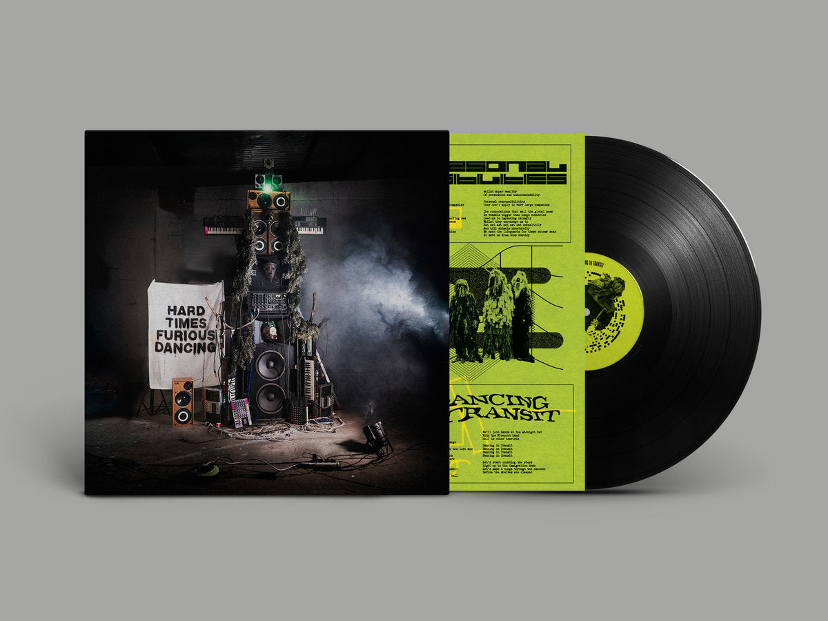Snapped Ankles - Hard Times Furious Dancing album cover, green insert and black vinyl record. 