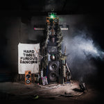 Snapped Ankles - Hard Times Furious Dancing album cover showing an artistic installation with electronic equipment and text in a dark setting