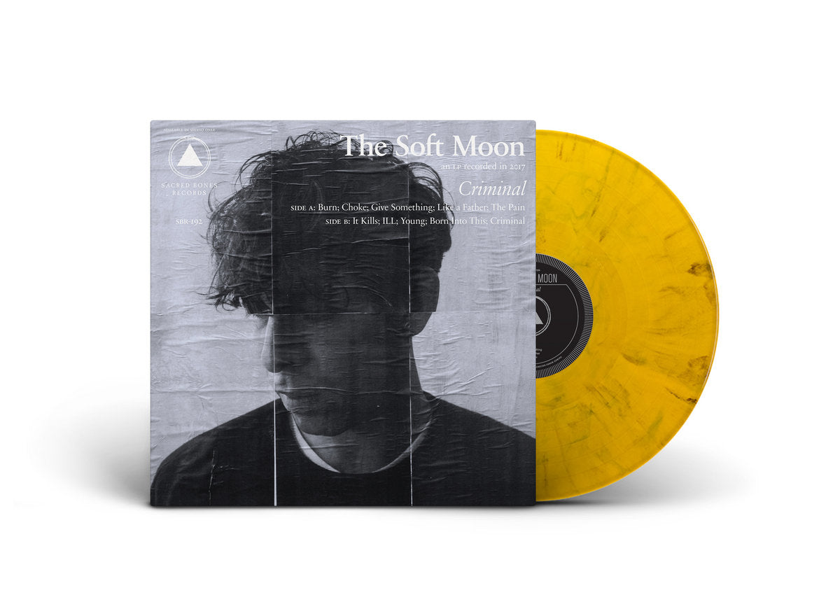 The Soft Moon - Criminal vinyl record with yellow disc and album cover featuring a black and white portrait.