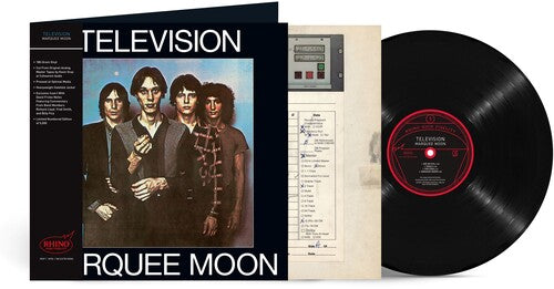 Vinyl record with cover and inner sleeve featuring a band portrait and album details.
