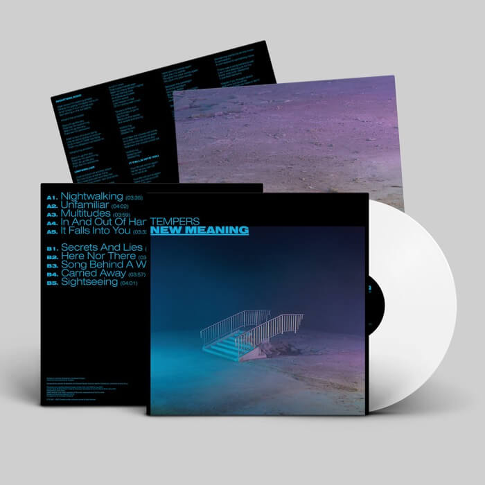 Vinyl record with cover and white disc on a gray background