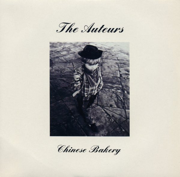 Album cover with a person wearing a hat and plaid shirt, text 'The Auteurs' and 'Chinese Bakery' on a light background.