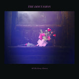 Album cover for The Discussion - All The Pretty Flowers with a floral arrangement on a windowsill in a dark setting.
