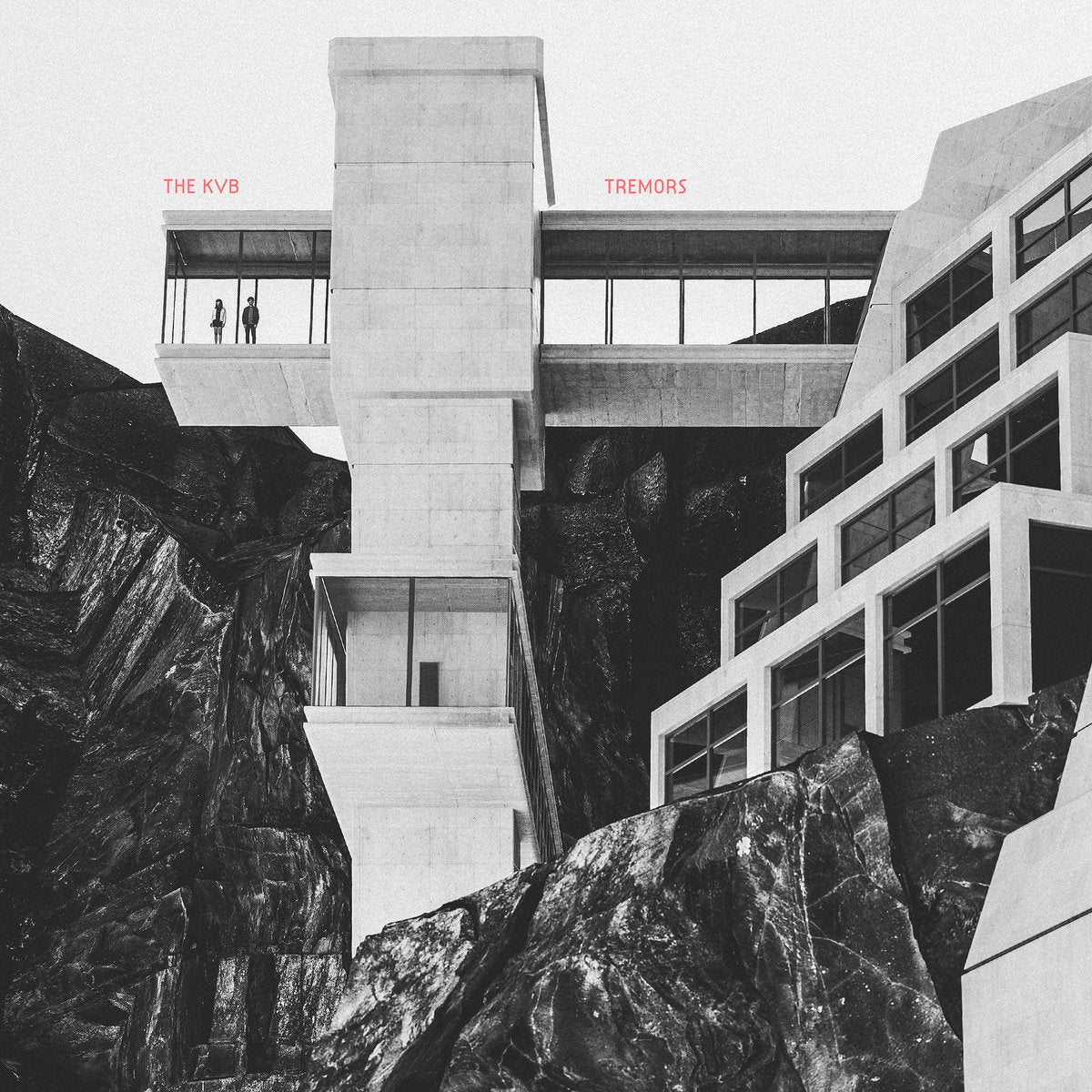 Album cover with architectural design and text 'The KVB Tremors' on a mountainous background