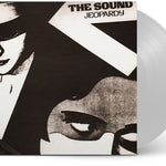 Clear vinyl record with a stylized cover featuring a face and text 'The Sound Jeopardy'.