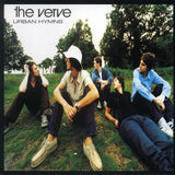 Album cover of 'Urban Hymns' by The Verve with band members sitting on grass.
