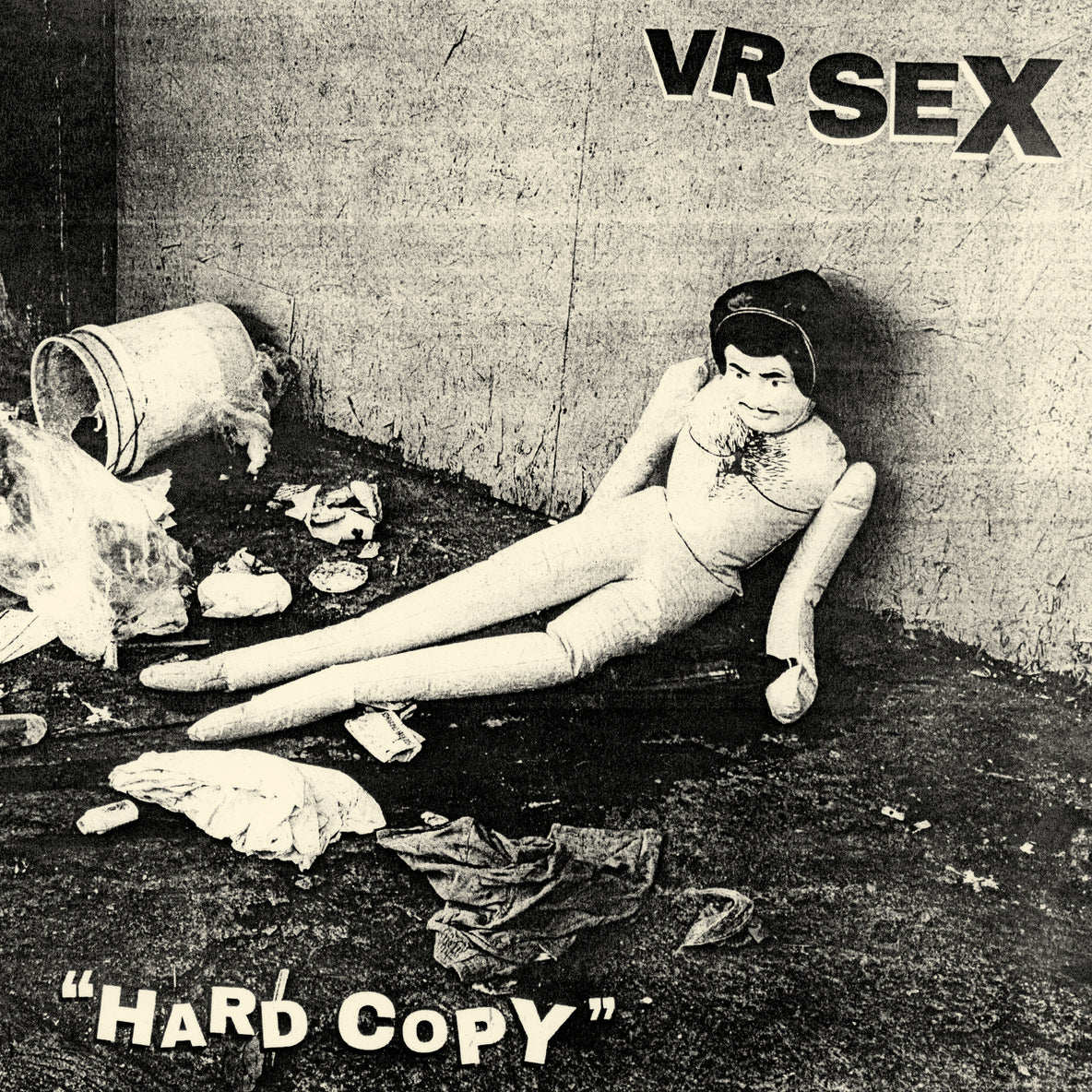 Vintage-style image with a blow up doll on the floor and text 'VR SEX HARD COPY' on a plain background