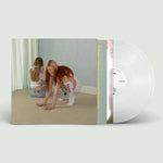 Vinyl record with cover showing two people on a beige background