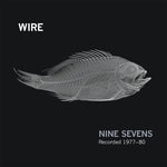 Album cover for Wire - Nine Sevens  with a fish skeleton illustration on a black background