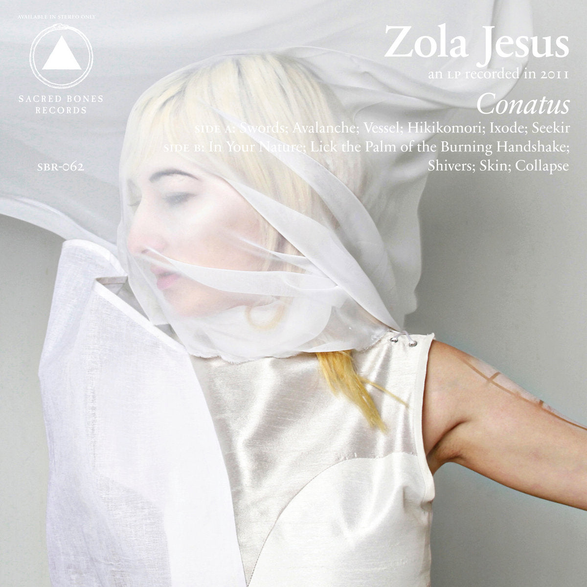 Album cover with a person wearing a white garment and veil, featuring text  Zola Jesus  - Conatus  and album tracks.